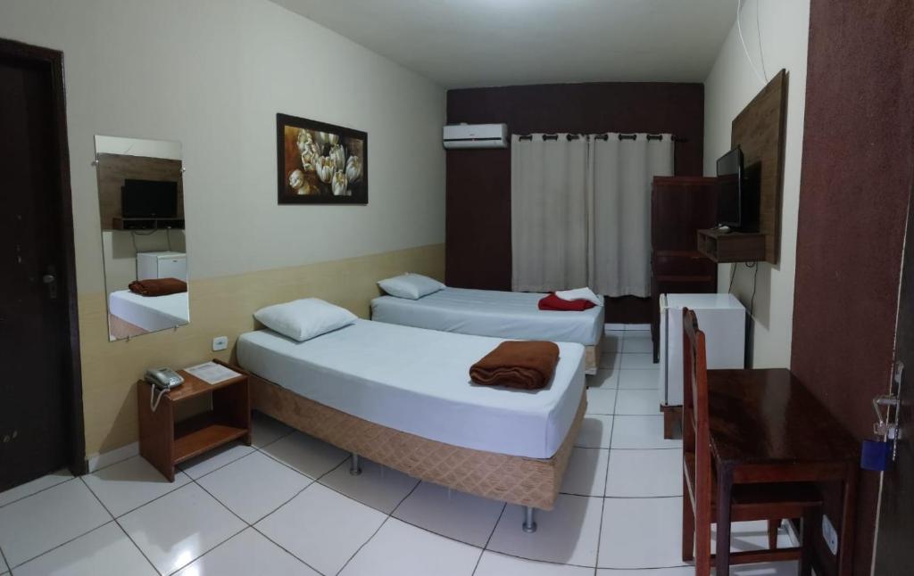 Ένα ή περισσότερα κρεβάτια σε δωμάτιο στο Hotel Central