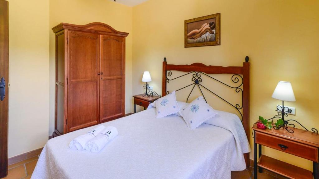 Posteľ alebo postele v izbe v ubytovaní Cortijo Los Tulipanes Periana by Ruralidays