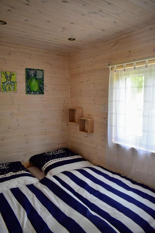 Postel nebo postele na pokoji v ubytování Tinyhaus BLÜCHER