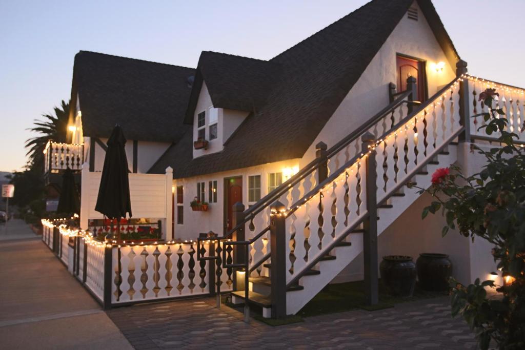 a house with a staircase with lights on it at New Haven Inn in Solvang