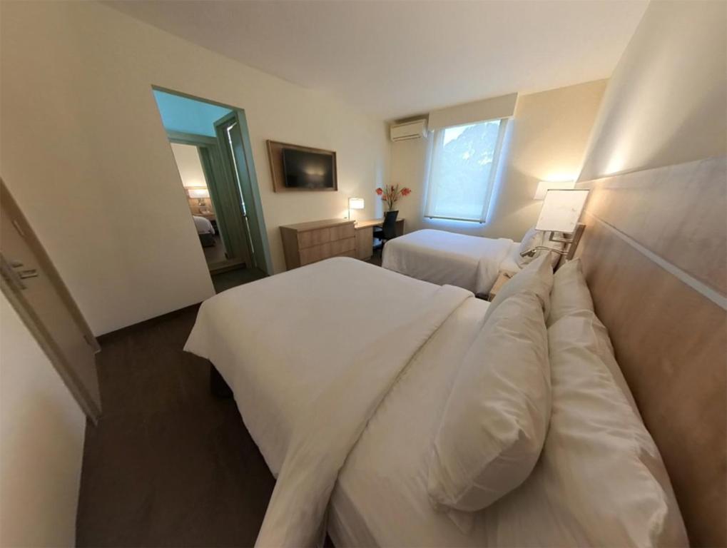 Postel nebo postele na pokoji v ubytování Hotel Santa Maria de Comayagua