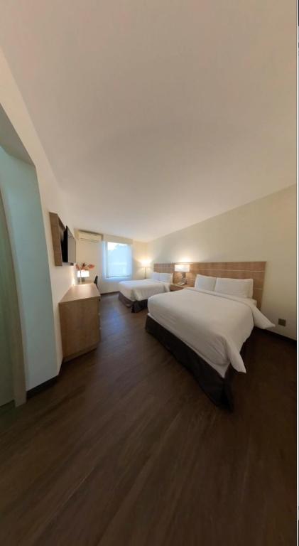 Postel nebo postele na pokoji v ubytování Hotel Santa Maria de Comayagua