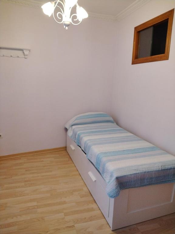 A bed or beds in a room at A Casiña De Abaixo