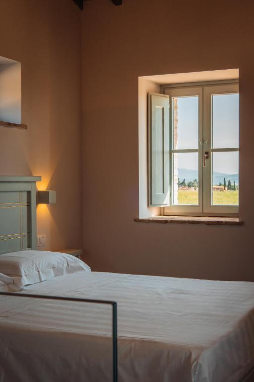 Voodi või voodid majutusasutuse Agriturismo Molinella toas
