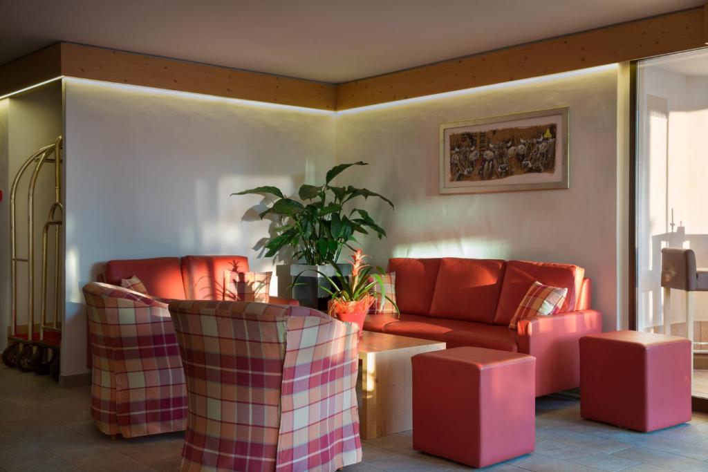 Posezení v ubytování Hotel Helvetia Intergolf