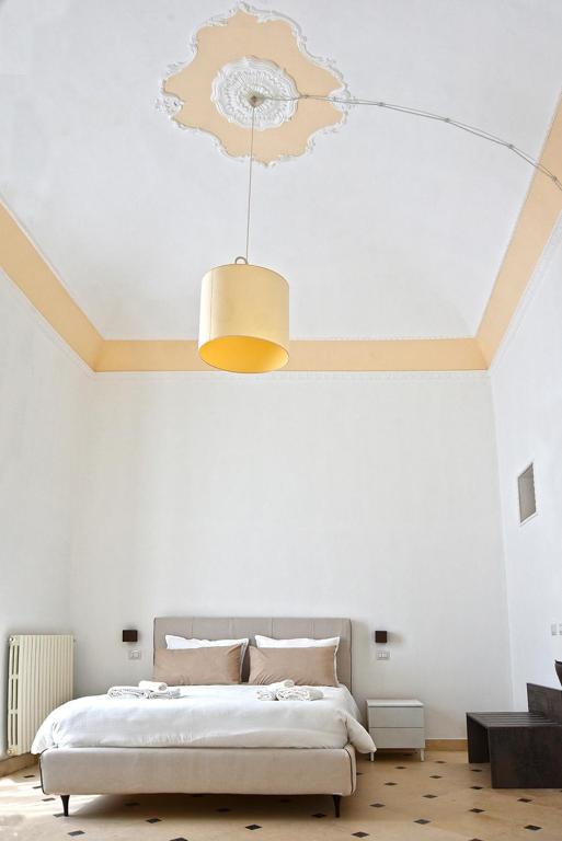 Postel nebo postele na pokoji v ubytování Adhoc Rooms