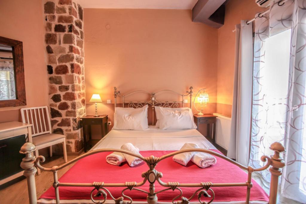 Postel nebo postele na pokoji v ubytování Mythos Guesthouse