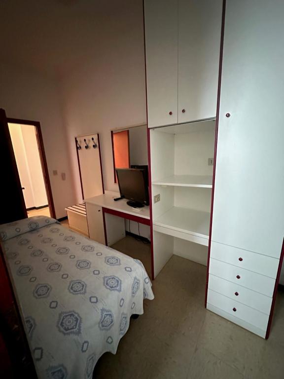 Postel nebo postele na pokoji v ubytování Hotel Reno