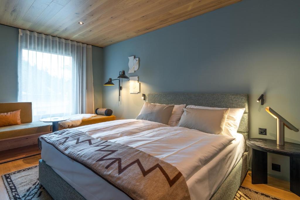 Postel nebo postele na pokoji v ubytování Sunstar Pontresina