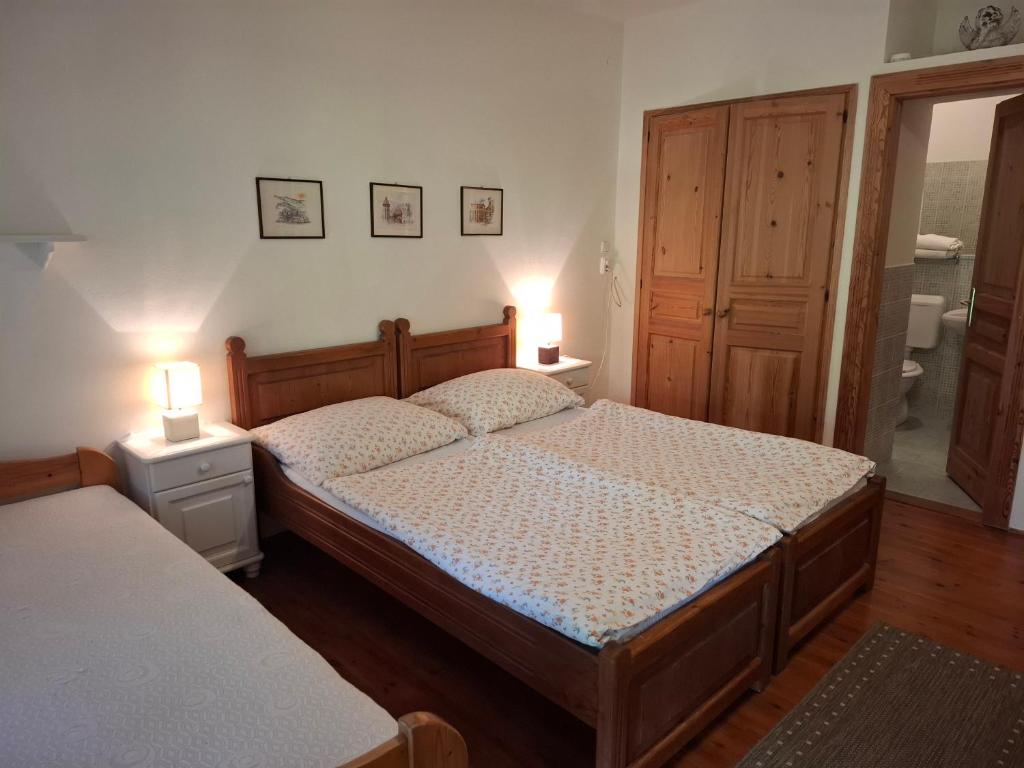 Postel nebo postele na pokoji v ubytování Agyagos Vendégház