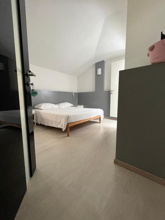 Postel nebo postele na pokoji v ubytování Bella Vita Guesthouse -parcheggio privato interno