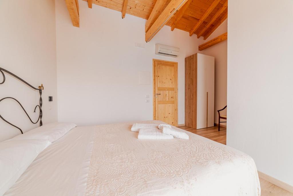 Postel nebo postele na pokoji v ubytování Agriturismo San Basilio