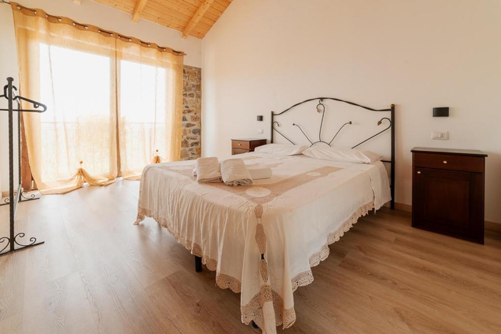 Postel nebo postele na pokoji v ubytování Agriturismo San Basilio