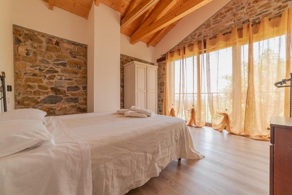 Postel nebo postele na pokoji v ubytování Agriturismo San Basilio