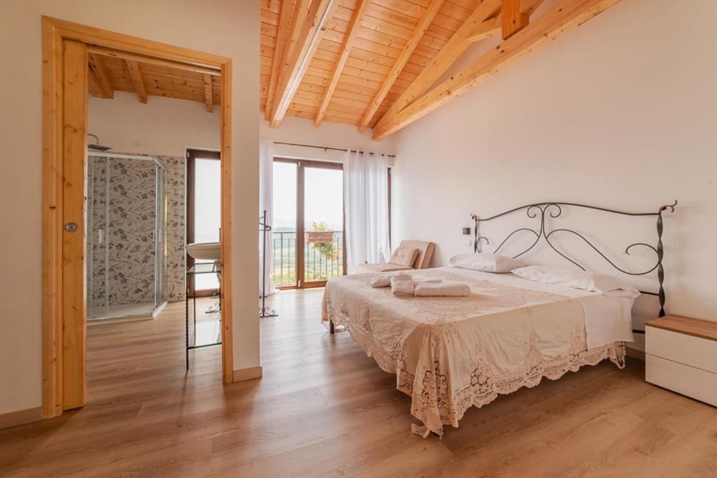 Postel nebo postele na pokoji v ubytování Agriturismo San Basilio