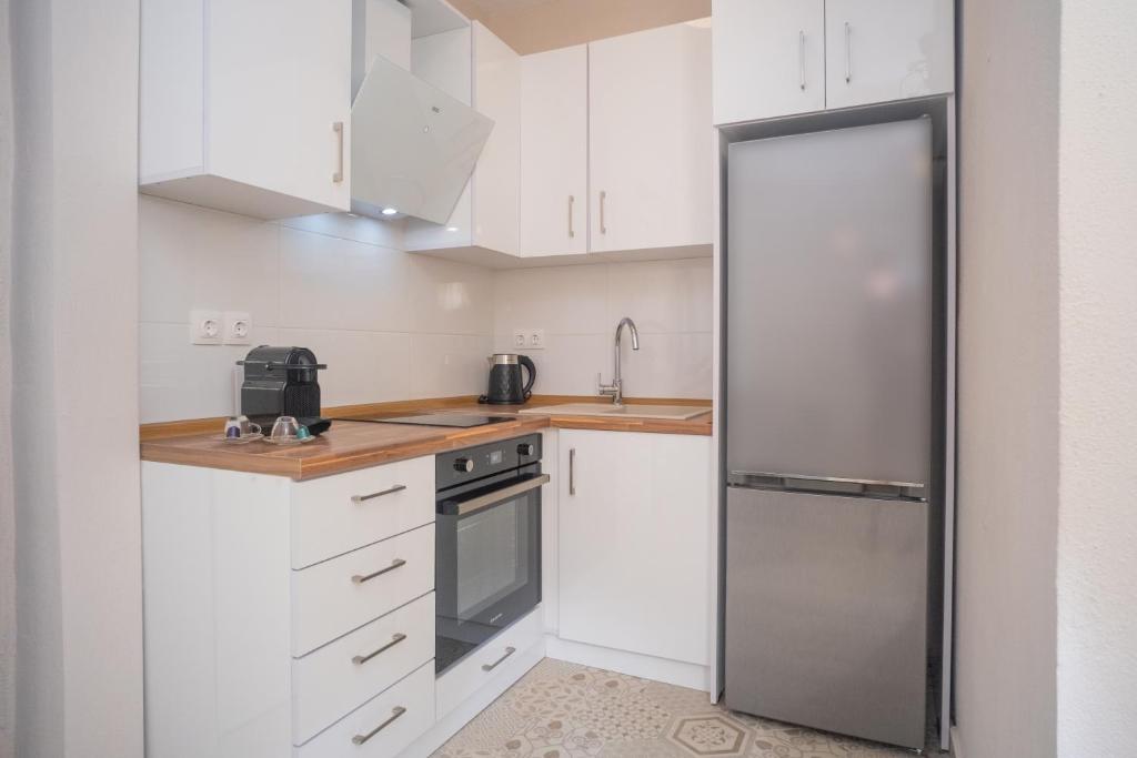 Kuchyň nebo kuchyňský kout v ubytování Cozy Home