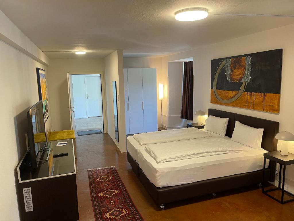 Postel nebo postele na pokoji v ubytování Hotel Swiss Bellevue Aathal