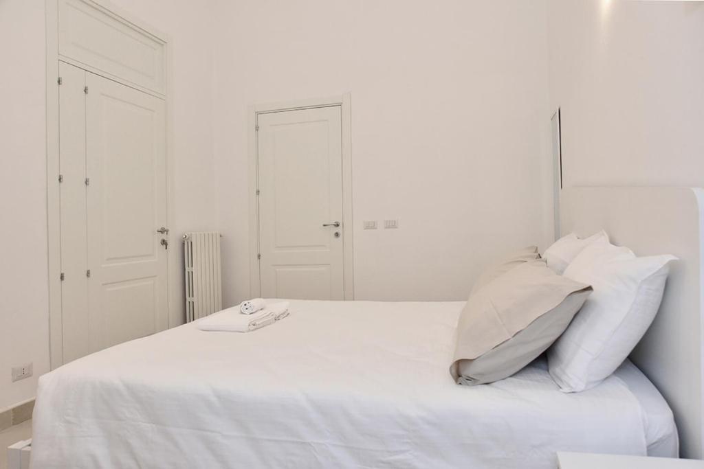 Postel nebo postele na pokoji v ubytování Adhoc Rooms