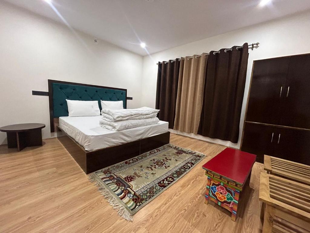 Postel nebo postele na pokoji v ubytování Dolker Homestay