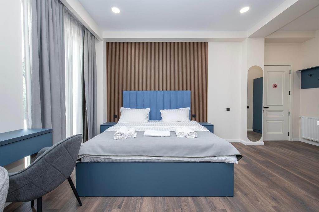 Ένα ή περισσότερα κρεβάτια σε δωμάτιο στο M&N Hotel