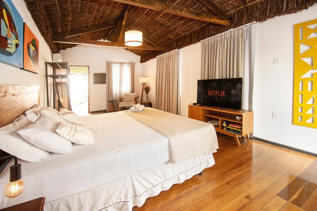 En eller flere senge i et værelse på Urca Hotel