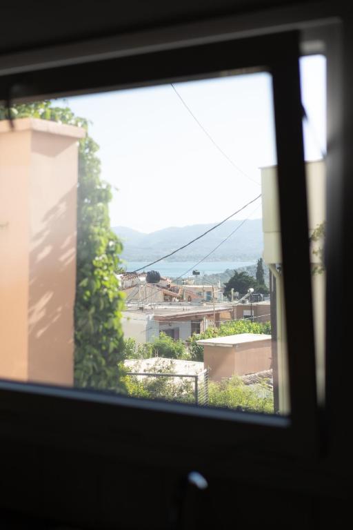 a view of a city from a window at Casa de Pera 2 in Loutrá