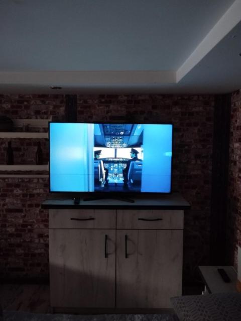 Telewizja i/lub zestaw kina domowego w obiekcie Hostel Texas
