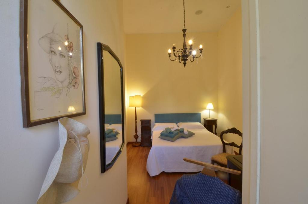 Postel nebo postele na pokoji v ubytování Domus Ponte