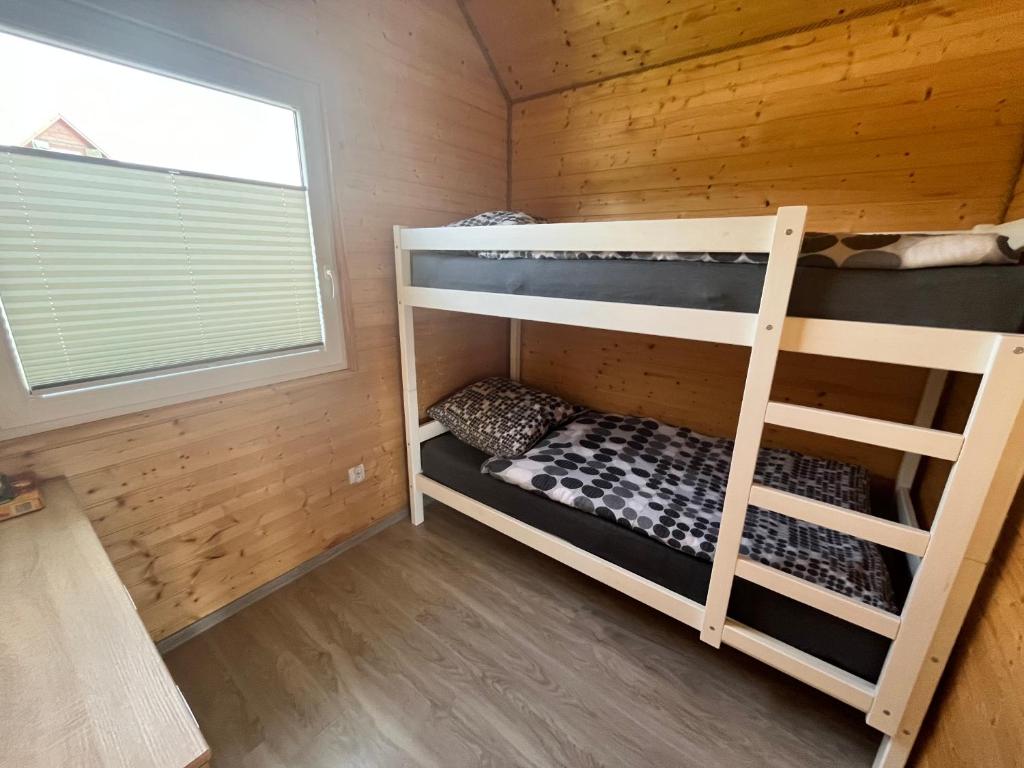 Postel nebo postele na pokoji v ubytování Domki Dafi