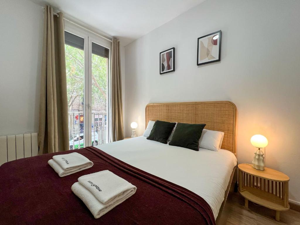 Posteľ alebo postele v izbe v ubytovaní Stay U-nique Apartments Urgell