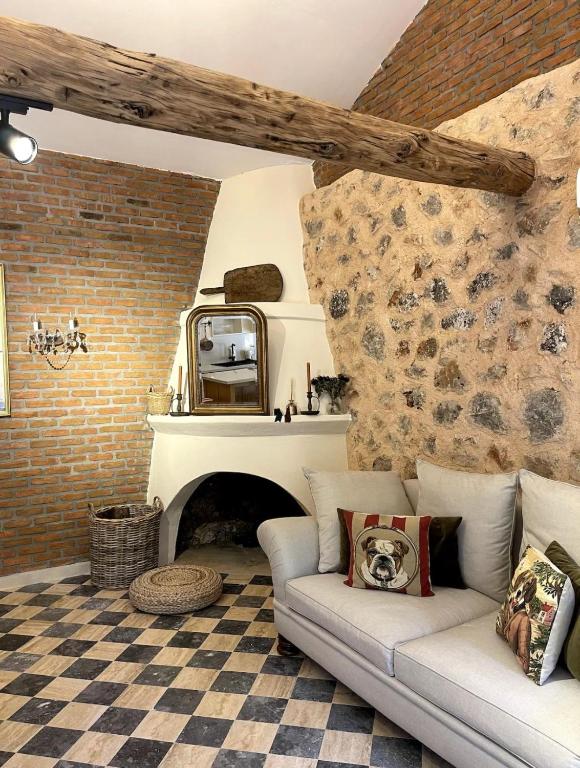 a living room with a couch and a fireplace at Merian's House in Fethiye