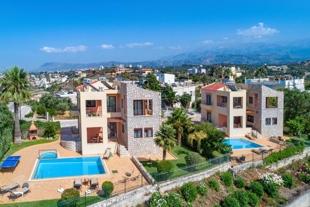 an aerial view of a villa with a swimming pool at Pasiphae villas 1 & 2 in Stalos