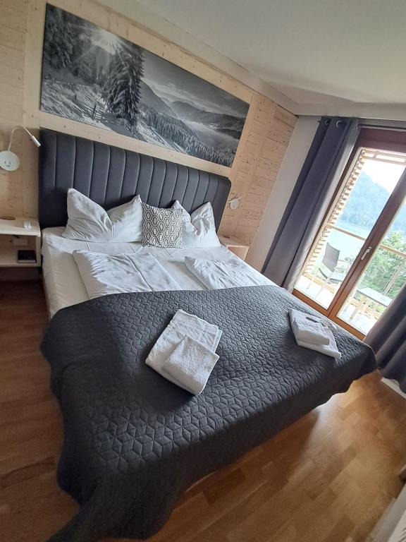 Postel nebo postele na pokoji v ubytování Jägerhotel