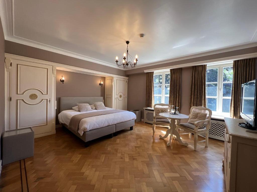 Letto o letti in una camera di Hotel Fleur de Lys