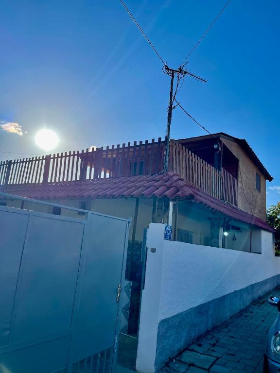a house with a fence in front of it at Guest House DEA in Vlorë