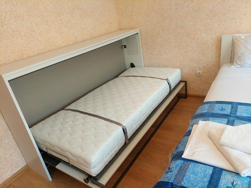 Postel nebo postele na pokoji v ubytování Forest View Apartment