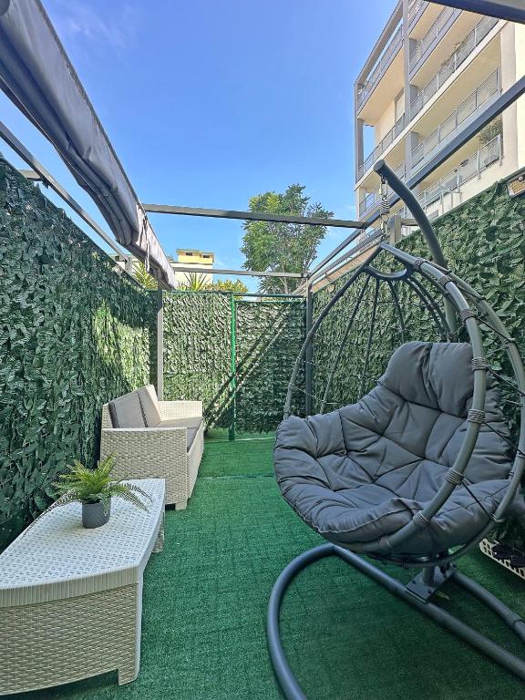 a swing on the balcony of a building at Vigentino Suites in Milan