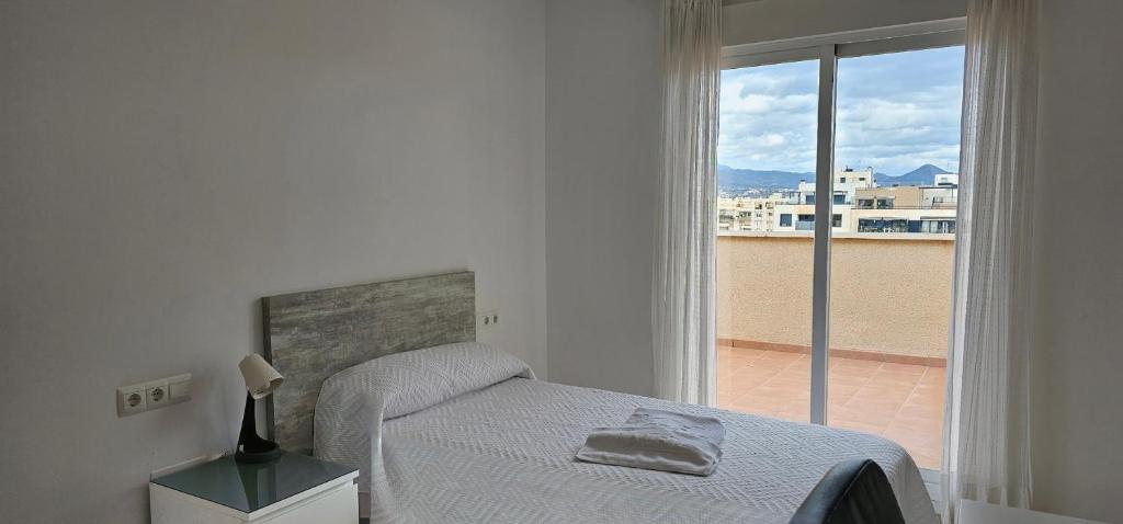 Postel nebo postele na pokoji v ubytování Hostel Residencia Alfil
