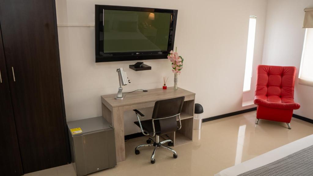 TV a/nebo společenská místnost v ubytování Diagonal Hotel Chipichape