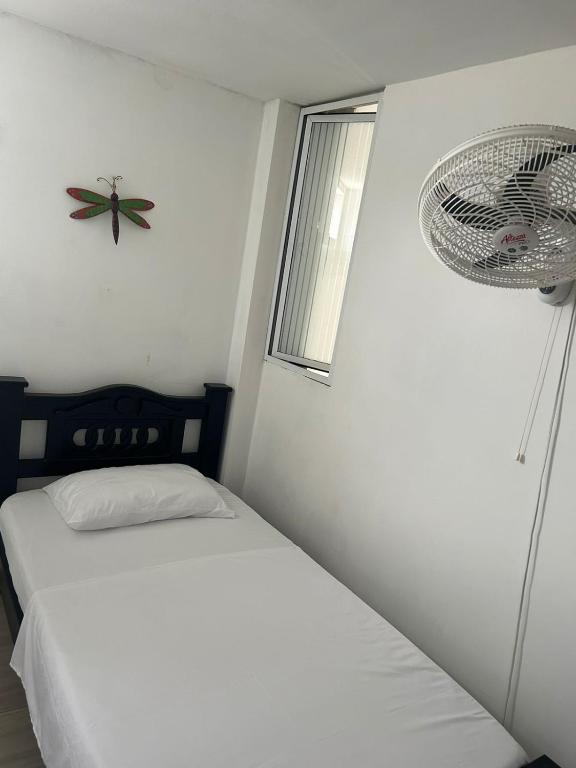 Postel nebo postele na pokoji v ubytování Hotel Encanto Vallenato