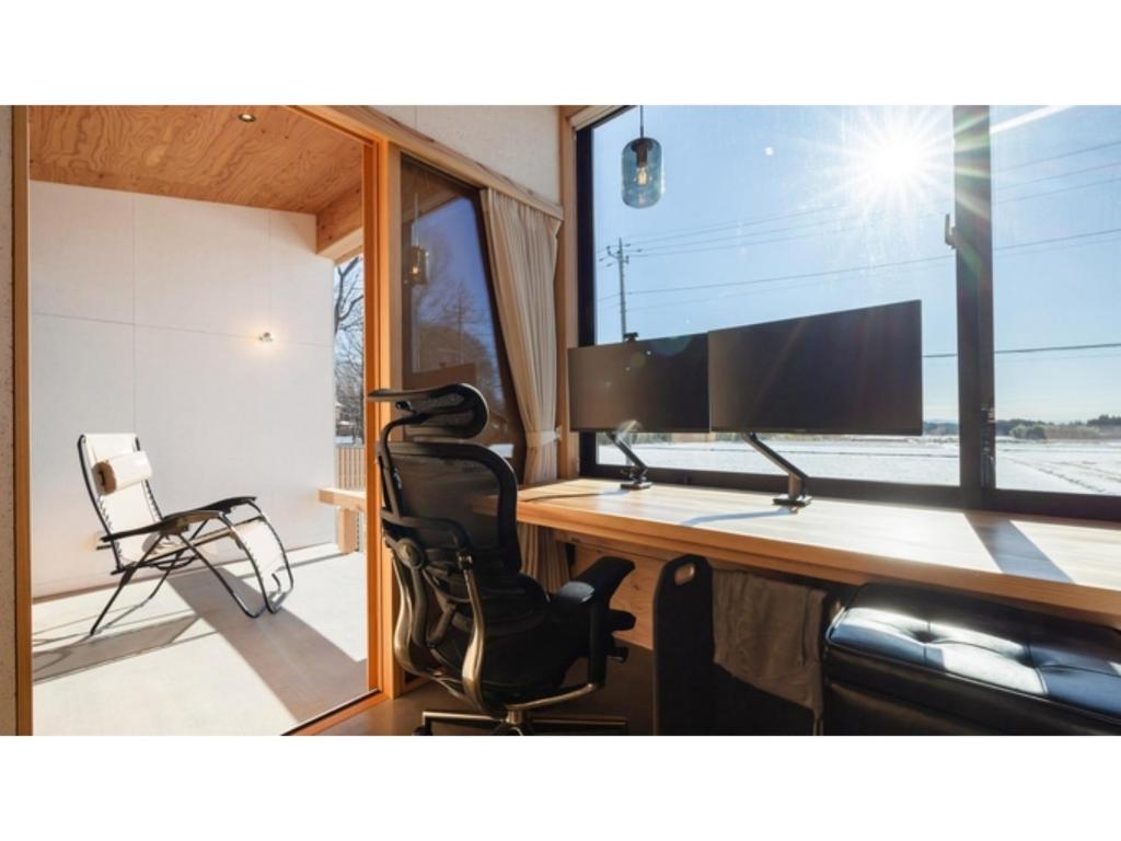 a room with a desk with a monitor and a chair at Mori de Waoke Nasuppo - Vacation STAY 23918v in Nasu-yumoto