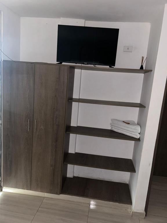 TV a/nebo společenská místnost v ubytování Hotel Encanto Vallenato