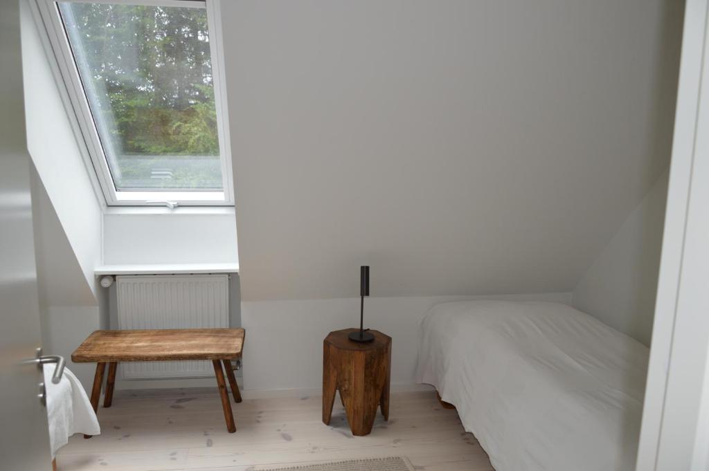 Postel nebo postele na pokoji v ubytování Svendlundgaard Apartments