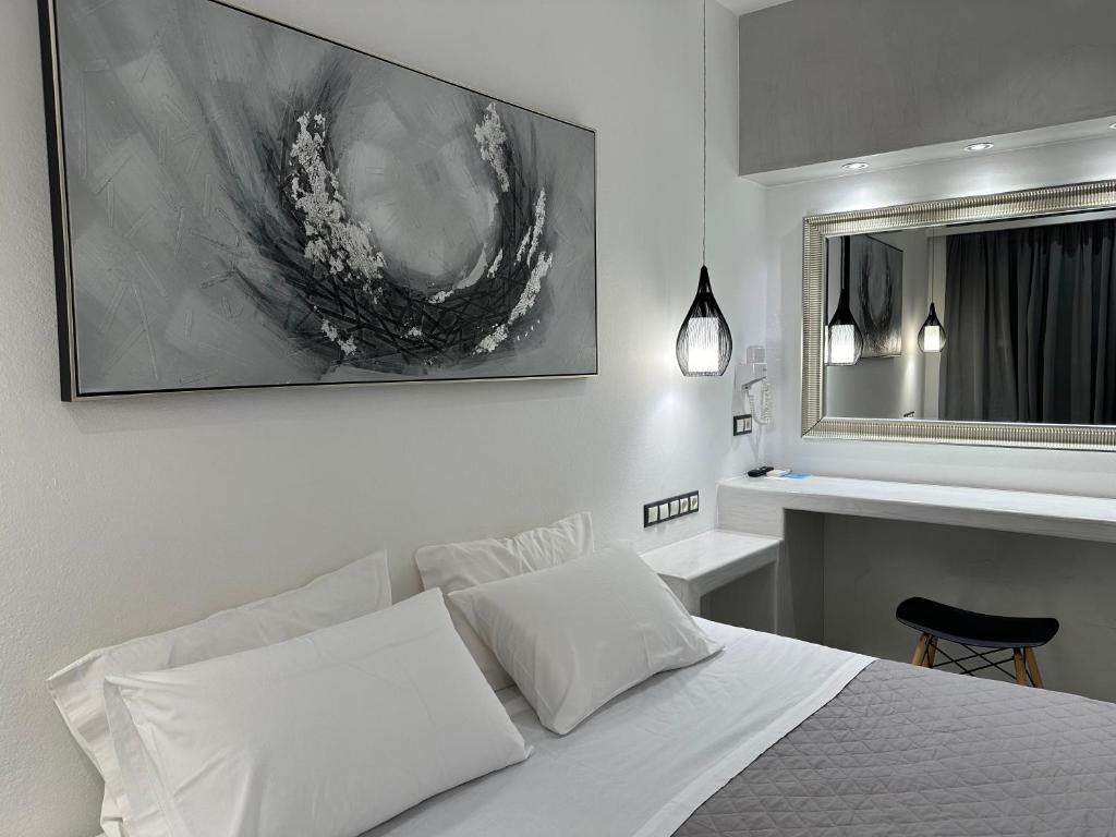 Łóżko lub łóżka w pokoju w obiekcie Aphrodite Hotel & Apartments