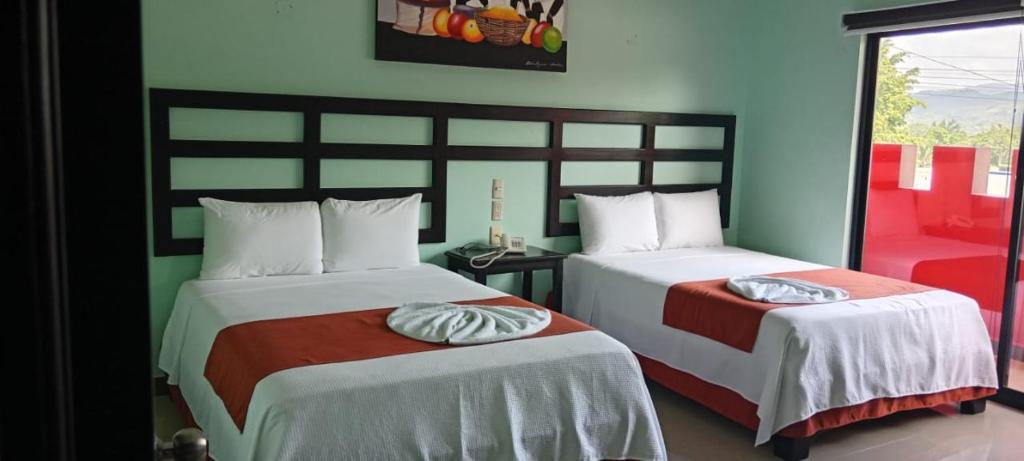 Postel nebo postele na pokoji v ubytování Hotel Castillo Del Rey
