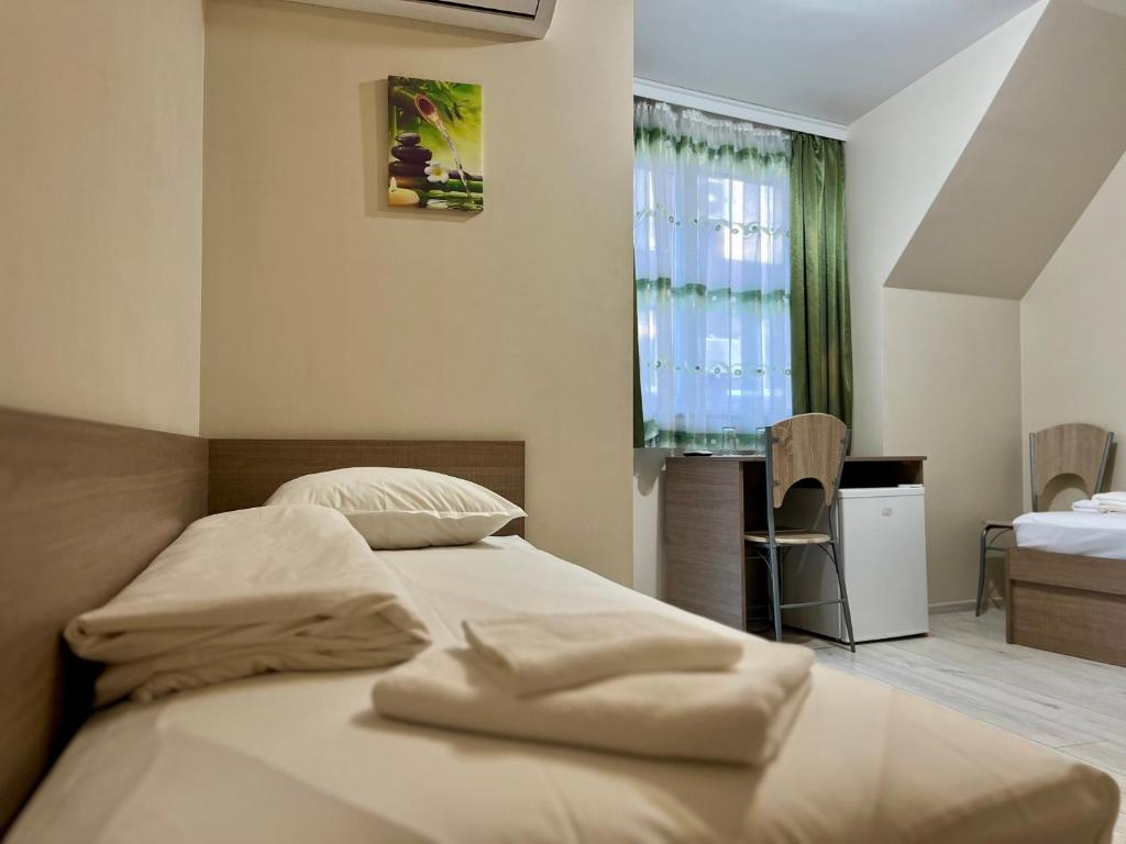 Postel nebo postele na pokoji v ubytování Хостел Атлас - Hostel Atlas