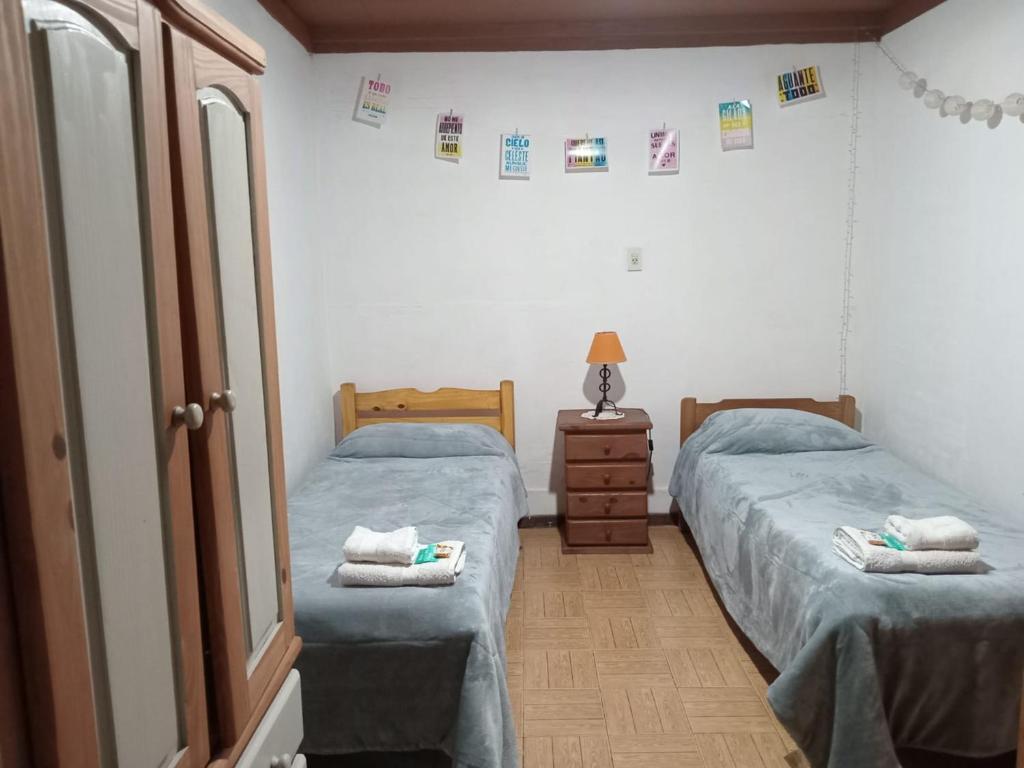 Postel nebo postele na pokoji v ubytování Tangohogar