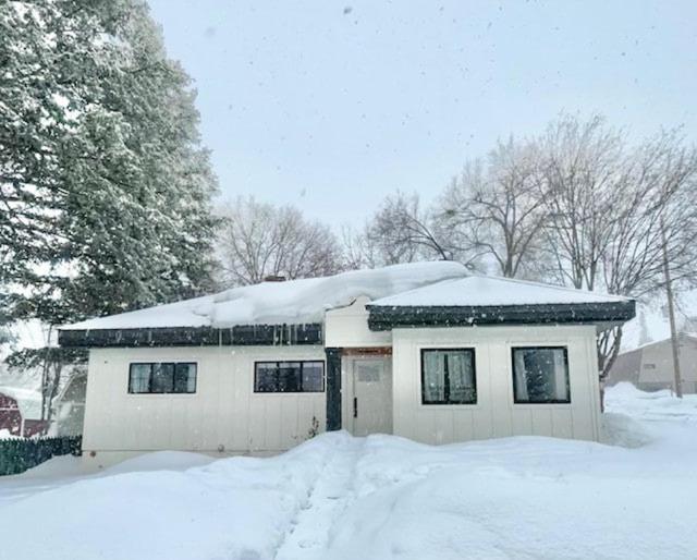 a house with snow on top of it at Whitewater Cottage- IN TOWN walk to everything in Lava Hot Springs
