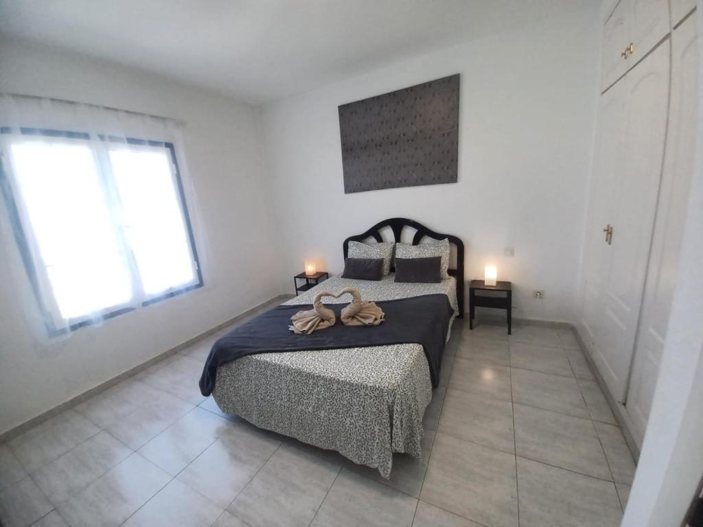 Postel nebo postele na pokoji v ubytování Relax playa blanca