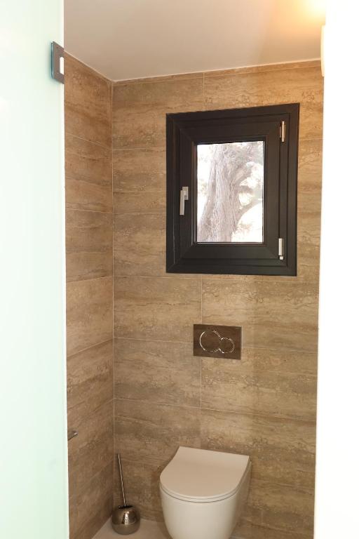 Koupelna v ubytování Caldera Suites "Φάρος"
